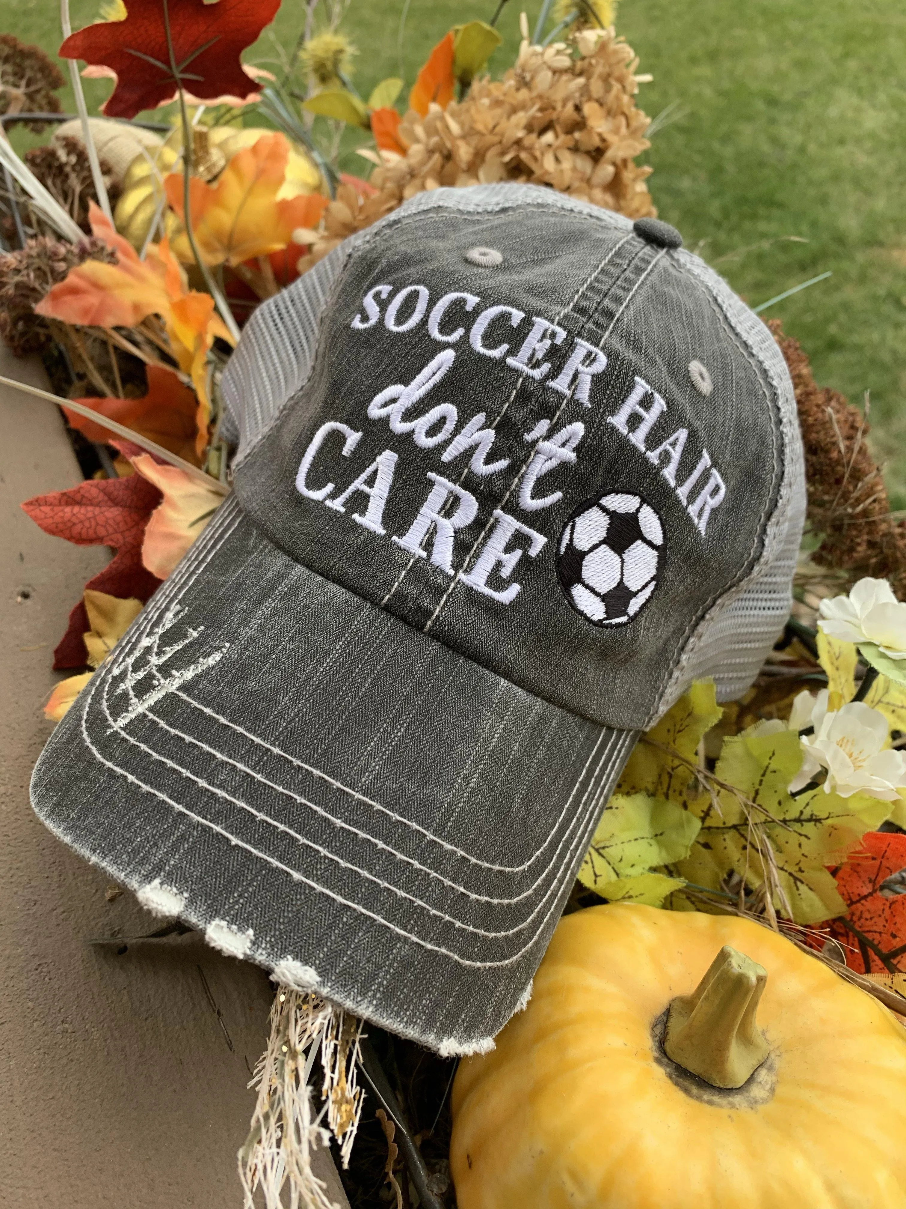 Hats { Soccer hair don’t care } Gray embroidered distressed trucker cap with adjustable Velcro and hole for pony. Soccer ball. Soccer mom.