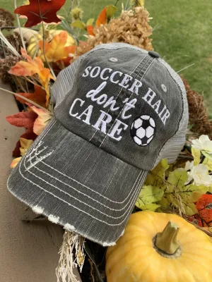 Hats { Soccer hair don’t care } Gray embroidered distressed trucker cap with adjustable Velcro and hole for pony. Soccer ball. Soccer mom.